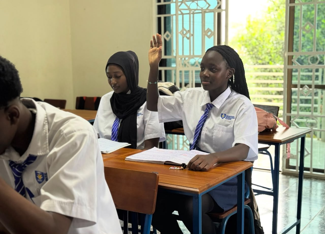 A Montana student raising her hand during a lesson